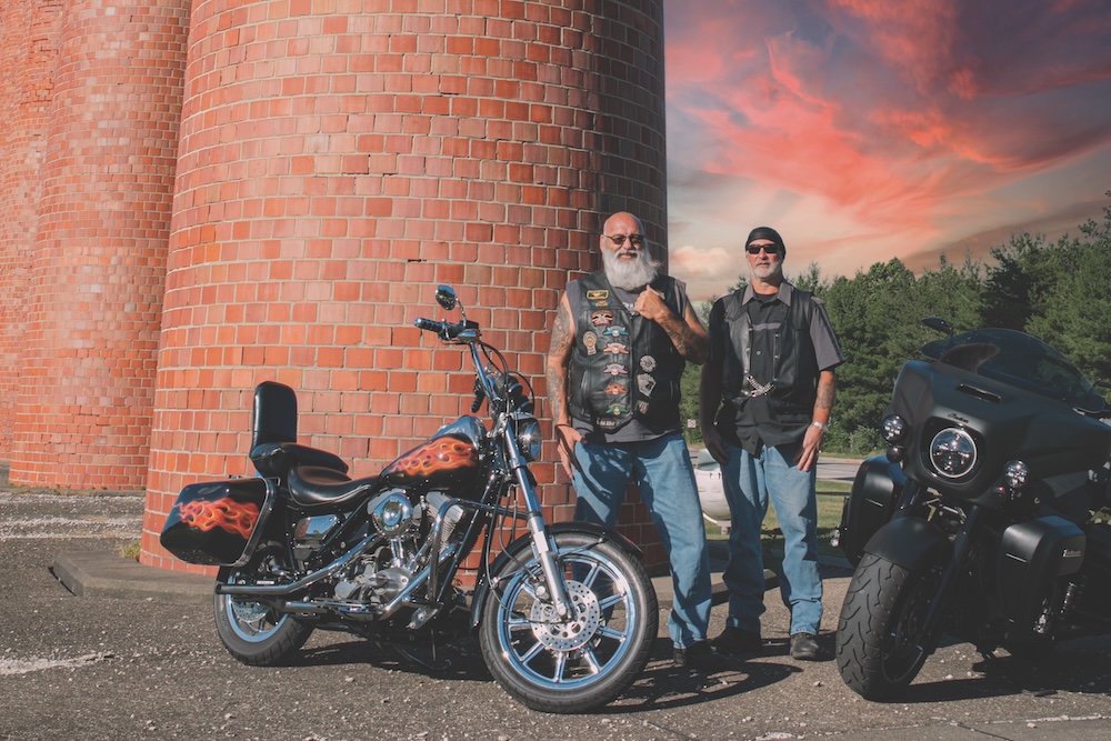 Motorcycle riders escorting the U.S. flag on the 250-mile Sojourn250 ride, featured in Pittsburgh Magazine.